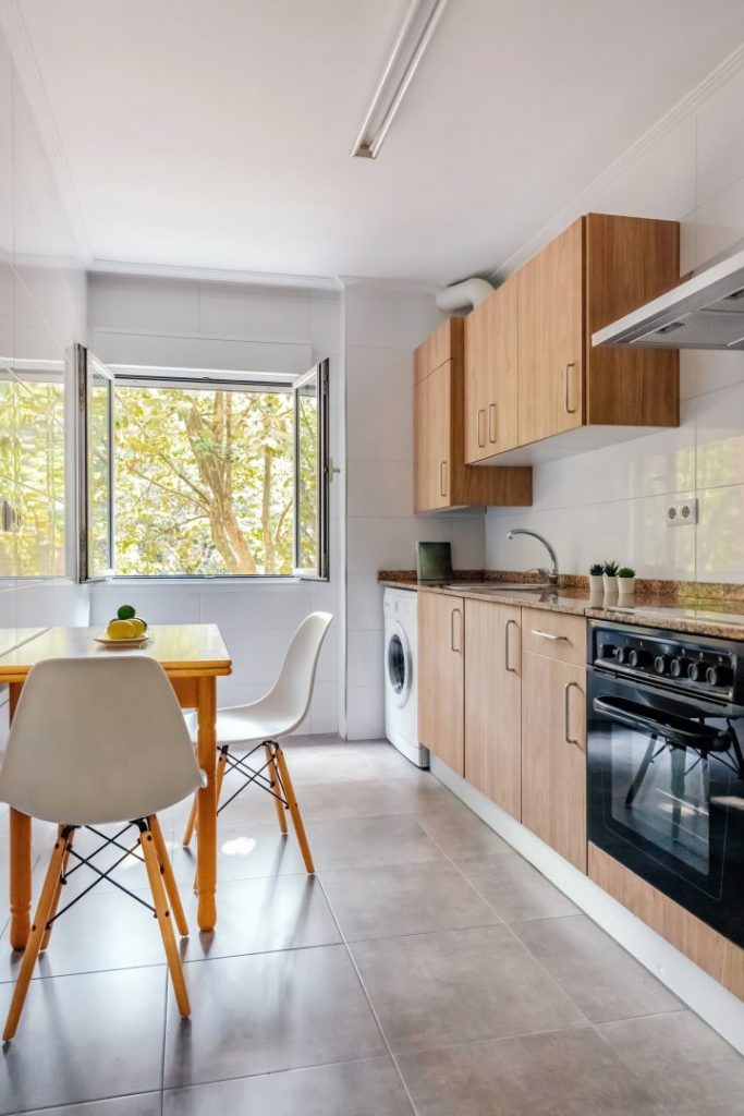 Kitchen interior with furniture and appliances