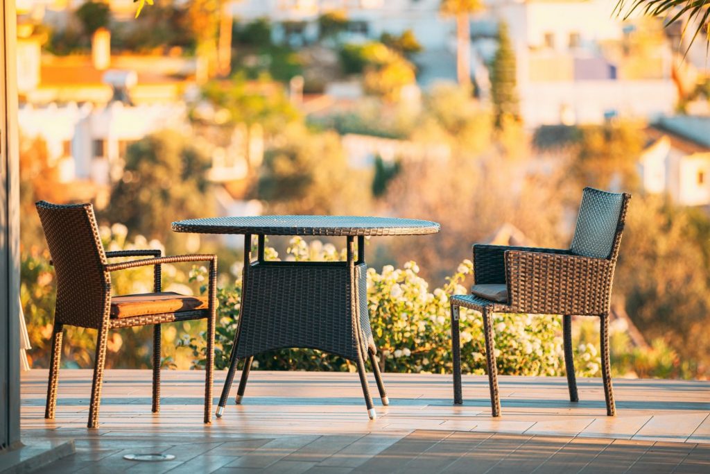 Wicker Furniture - Table And Chairs In A Wooden Terrace